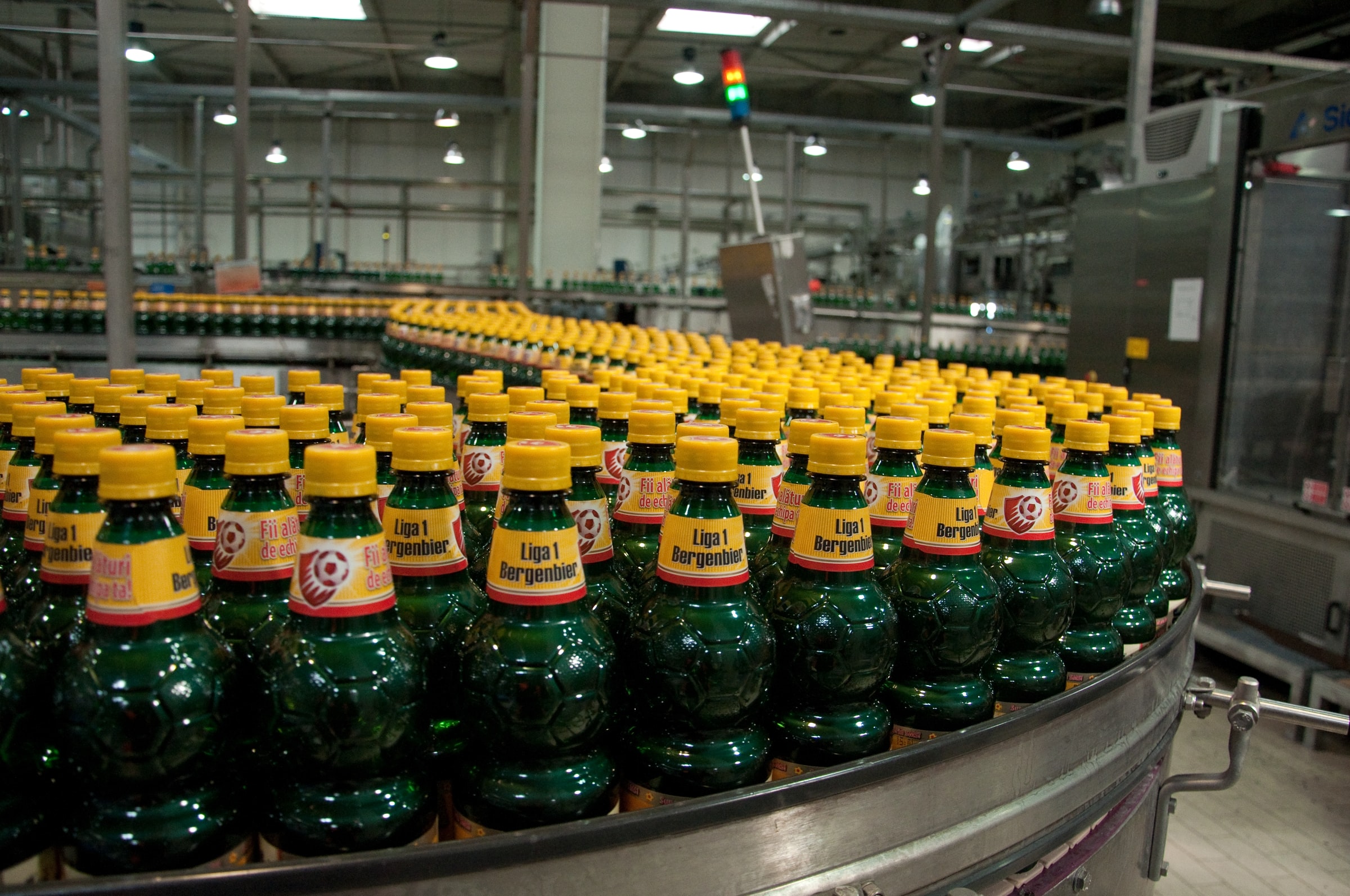 Beverage bottling line with Andon Lights. Credit: Niculcea Florin on Unsplash